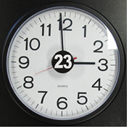 A clock with a 23-hour awareness button in the center of the dial.